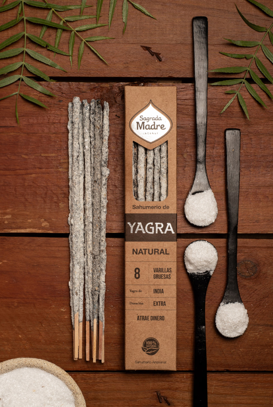 Yagra natural product packaging with sticks and spoons on a wooden background