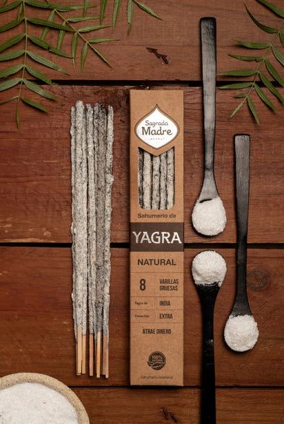Yagra natural product packaging with sticks and spoons on a wooden background
