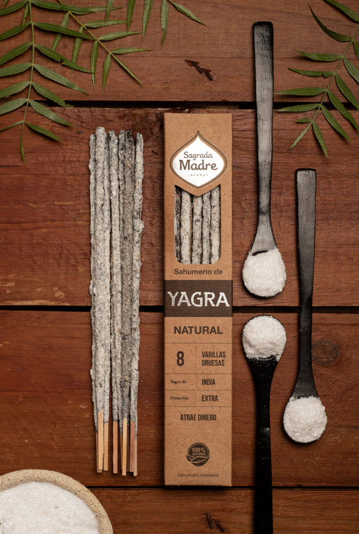 Yagra natural product packaging with sticks and spoons on a wooden background