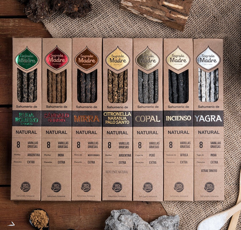 Row of incense packaging boxes on a textured surface