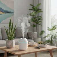 Humidifier on a wooden table with plants and a cup in a living room setting