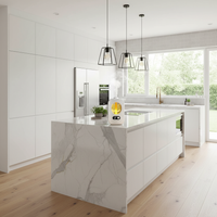 Modern kitchen with white marble island and pendant lights