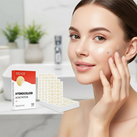 Woman applying hydrocolloid acne patches with packaging in the background